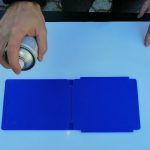 Spraying clear coat on plastic.