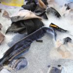 Washing clothes with dish soap.