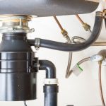 Can the ingredients in commercial drain cleaners damage a garbage disposal system.