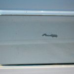 Removing silicone from glass.