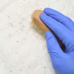 Cleaning mold stains from the mattress.
