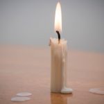 Removing candle wax from wood.