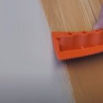 Painting laminate furniture to look like wood.