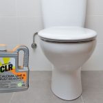 Using CLR on a toilet bowl.