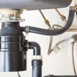 Instructions about tightening a garbage disposal blades.