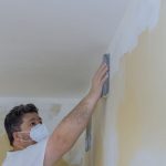 Inhaling drywall dust.