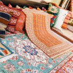 Hanging a tapestry on a ceiling.